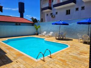 Swimmingpoolen hos eller tæt på 100mts DA PRAIA com Churrasqueira, Piscina e Wi-Fi