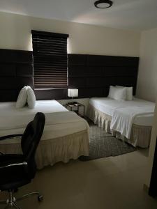 Postel nebo postele na pokoji v ubytování Starz hotel