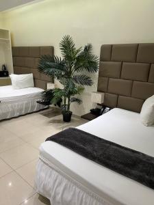 Postel nebo postele na pokoji v ubytování Starz hotel
