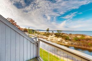 a balcony with a view of the water at Great Lakes 49 50 in Glen Arbor
