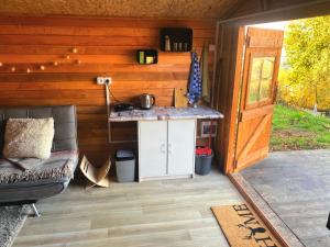 a patio with a counter and a couch and a table at Děčínska chatka in Děčín