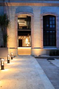 a building with an open door with lights in it at Hotel Casa Cantera in Oaxaca City