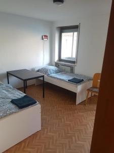 En eller flere senger på et rom på Monteurunterkunft Königstein