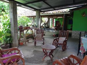 a group of chairs and a table in a room at Loren's house in Moyogalpa