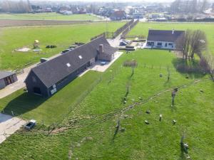 an aerial view of a farm with sheep in a field at De Kaleihoeve in Bavikhove