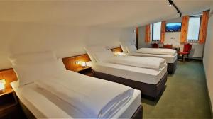 Postel nebo postele na pokoji v ubytování Hotel Garni Belvedere