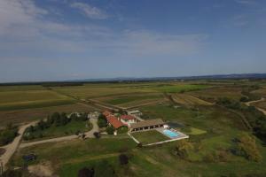 an aerial view of a house with a swimming pool at Family villa at 1H15 from Lyon in Prétieux