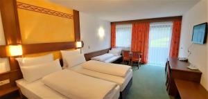 Postel nebo postele na pokoji v ubytování Hotel Garni Belvedere