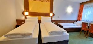 Postel nebo postele na pokoji v ubytování Hotel Garni Belvedere