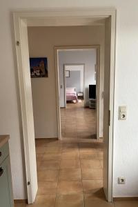 an empty room with a hallway with a bedroom at Ferienwohnung auf dem Kore in Kirkel