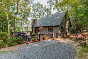 a cottage in the woods with a driveway at Star View Cabin - Powder Horn Mountain in Powderhorn Mountain