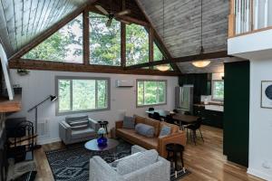 a living room with a couch and a table at Star View Cabin - Powder Horn Mountain in Powderhorn Mountain