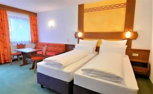 Postel nebo postele na pokoji v ubytování Hotel Garni Belvedere