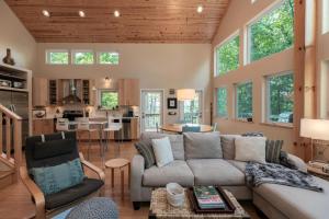 a living room with a couch and a table at Moonlight Ridge - Powder Horn Mountain in Powderhorn Mountain