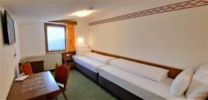 TV a/nebo společenská místnost v ubytování Hotel Garni Belvedere