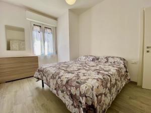 A bed or beds in a room at Appartamento Etruria