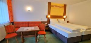 Postel nebo postele na pokoji v ubytování Hotel Garni Belvedere
