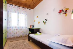 Postel nebo postele na pokoji v ubytování Apartman Toni, Gata + 27 fotografií