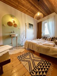 a bedroom with two beds and a sink in it at Na stoku in Korbielów