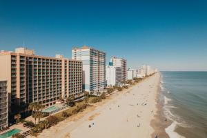 a view of a beach with buildings and the ocean at Sandcastle Oceanfront Resort South Beach in Myrtle Beach