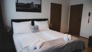 Ένα ή περισσότερα κρεβάτια σε δωμάτιο στο Hotel U Ševce