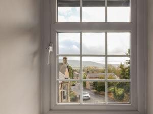 a window with a view of a street at Rose Cottage in Clitheroe