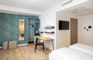 Giường trong phòng chung tại elaya hotel regensburg city center
