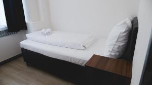 Ένα ή περισσότερα κρεβάτια σε δωμάτιο στο Hotel U Ševce