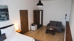 Ένα ή περισσότερα κρεβάτια σε δωμάτιο στο Hotel U Ševce