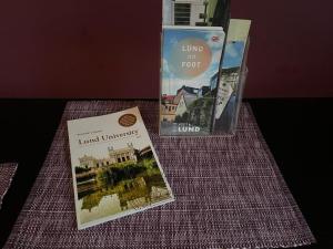 two books sitting on top of a table at The Garden House in Lund