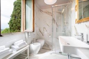 a bathroom with a sink and a toilet and a window at Art Hotel Villa Agape - Place of Charme in Florence +143 photos