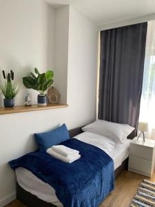 Posteľ alebo postele v izbe v ubytovaní Apartamenty nad zalewem 222