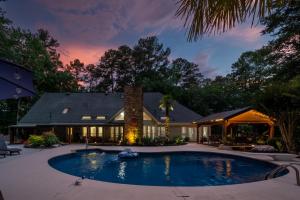 a house with a swimming pool in the yard at Relax In Private Pool & Cozy Gazebo At Param Farms in Cartersville