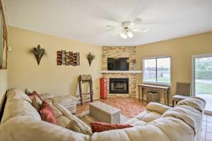 a living room with a couch and a fireplace at El Paso Retreat with Pool 11 Mi to Downtown! in El Paso
