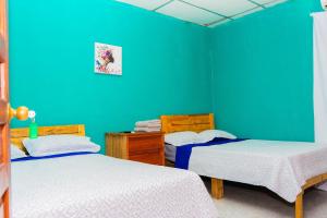 Een bed of bedden in een kamer bij Hostal Familiar Argeñal