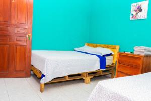 Een bed of bedden in een kamer bij Hostal Familiar Argeñal