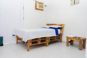 Een bed of bedden in een kamer bij Hostal Familiar Argeñal
