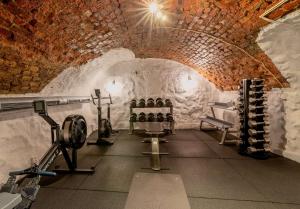 a gym in a cave with wine bottles at Hotel Gamla Stan, BW Signature Collection in Stockholm