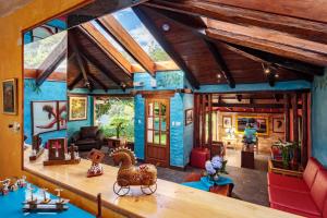 a doll house with a toy horse on a table at Luna Volcán, Adventure SPA - formerly Luna Runtún in Baños