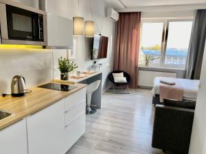 Kuchyňa alebo kuchynka v ubytovaní Exclusive Apartments Smolna