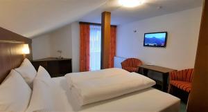 TV a/nebo společenská místnost v ubytování Hotel Garni Belvedere