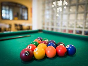 a group of billiard balls on a pool table at Hotel Parque Atlântico in Ubatuba