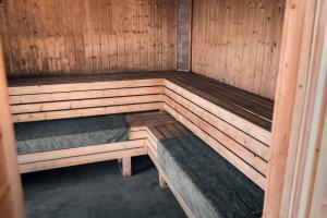 a wooden sauna with two bunk beds in it at Nad Narvią - dom na drzewie in Serock