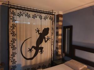 Postel nebo postele na pokoji v ubytování Lizards Lounge - Tanife Apartment beim Yumbo