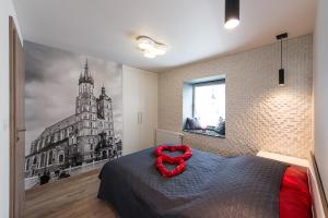 a bedroom with a black and white picture of a building at Cozy and Large 62 m2 Apartment with Air Conditioning, Old Town in Krakow