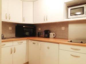 Kuchyňa alebo kuchynka v ubytovaní Appartement 6/7 personnes pied des pistes à Plagne centre
