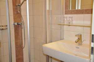Koupelna v ubytování Haus Voithofer + 37 fotografií