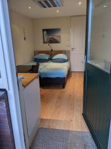 Giường trong phòng chung tại Logies21 Texel