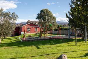 a park with an empty playground in a yard at Apartamentos Porcia in Tapia de Casariego