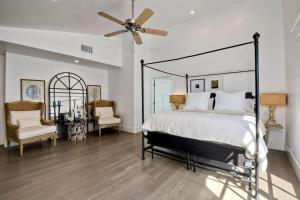 a bedroom with a bed and a ceiling fan at Luxury Ocean Views & Steps To The Sand - Tower 36 Upper Condo Unit in Carlsbad